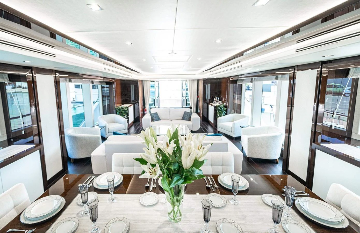 a dining room with a table set aboard QART HADASHT Yacht for Sale