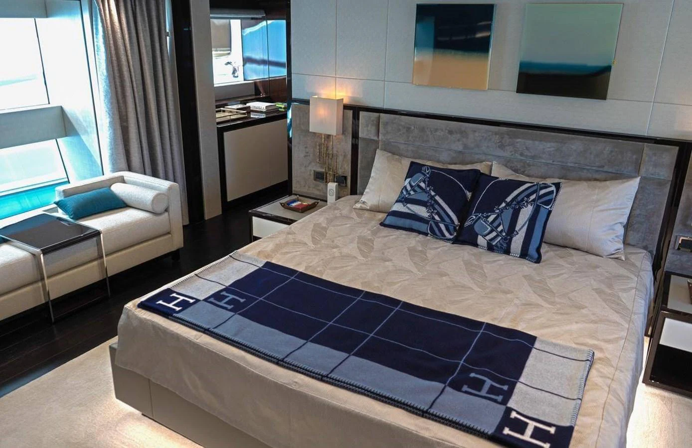 a bed with blue and white sheets aboard QART HADASHT Yacht for Sale