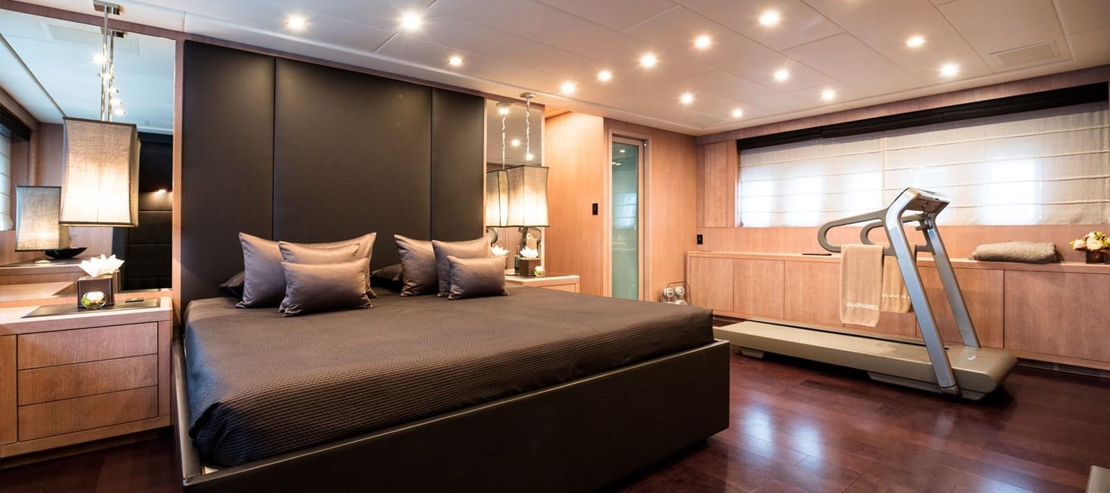 a large bed in a room aboard BLOOMS Yacht for Charter