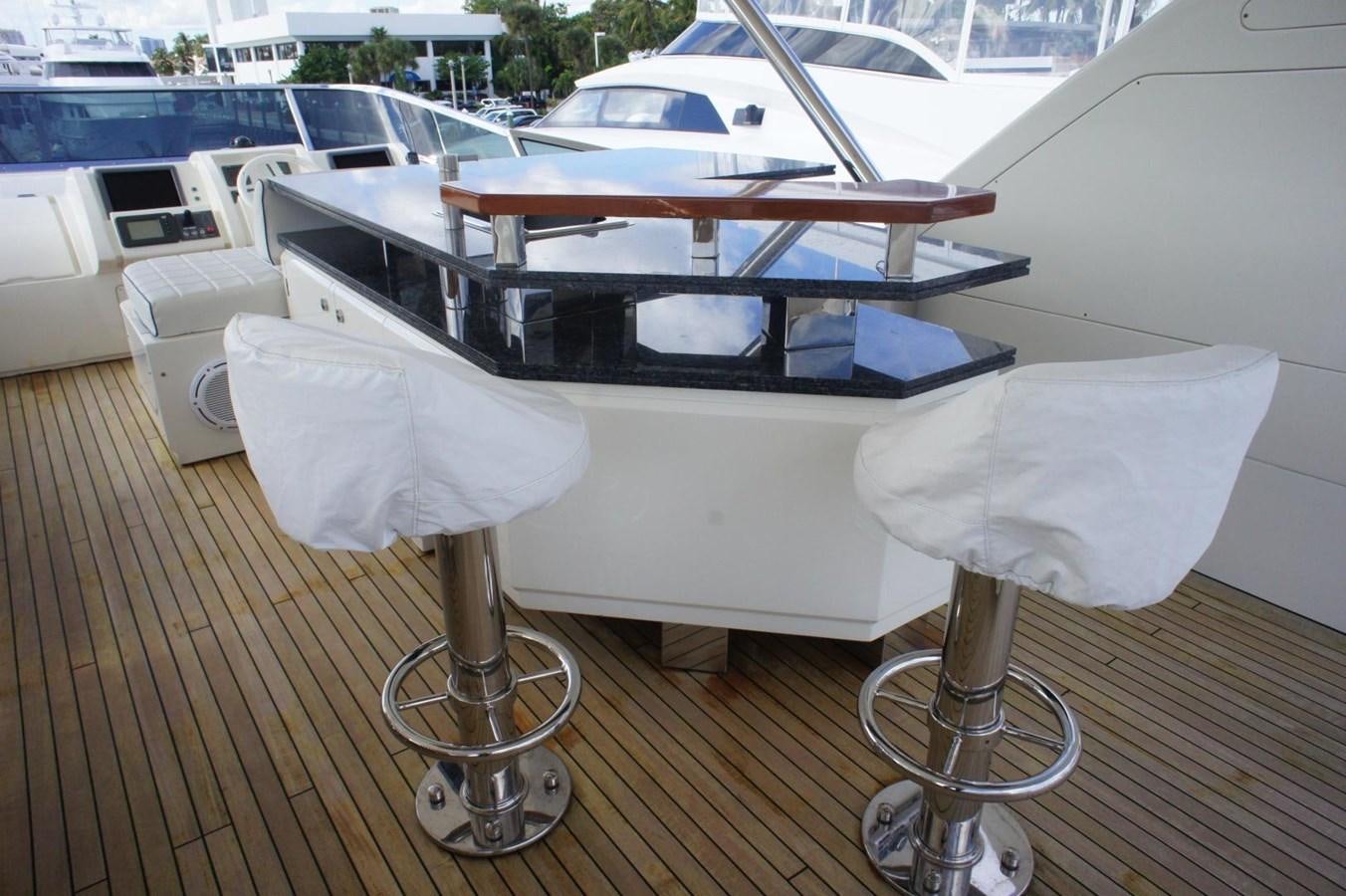 a table with chairs on it aboard CASPIAN Yacht for Sale