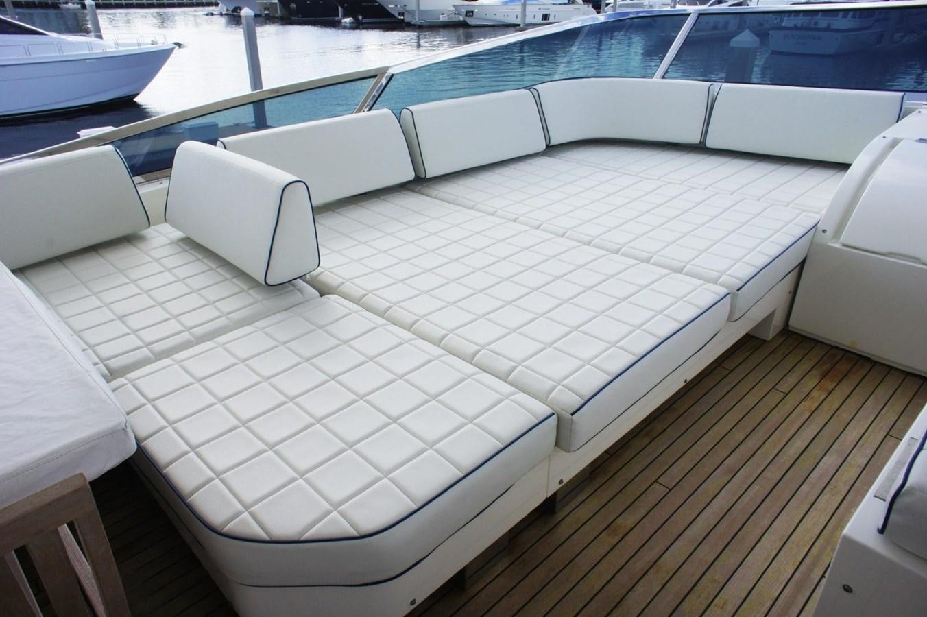 a deck with a chair and a table on it aboard CASPIAN Yacht for Sale