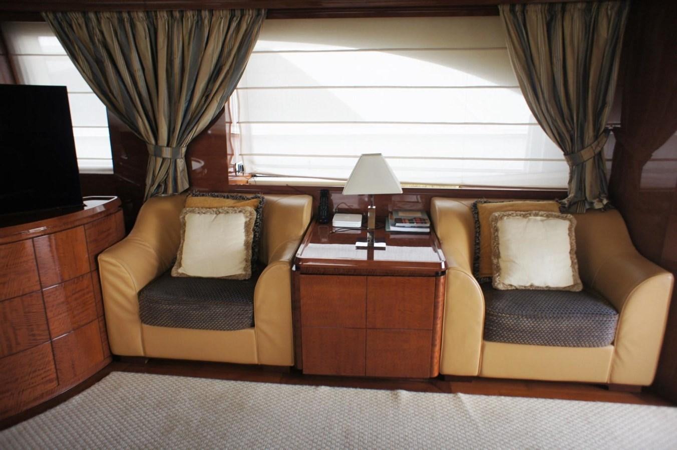 a living room with a couch and a coffee table aboard CASPIAN Yacht for Sale