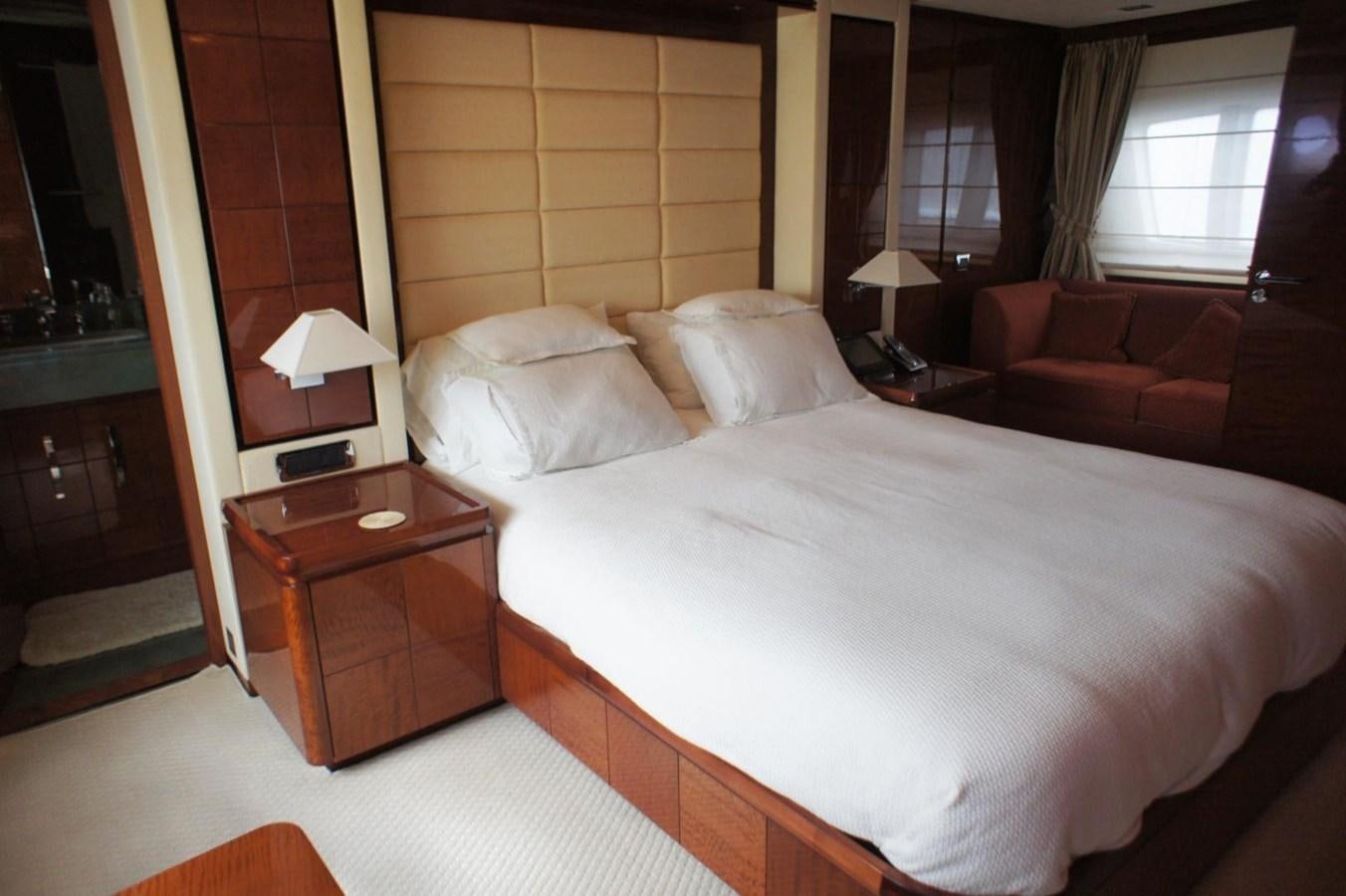 a bed with white sheets aboard CASPIAN Yacht for Sale