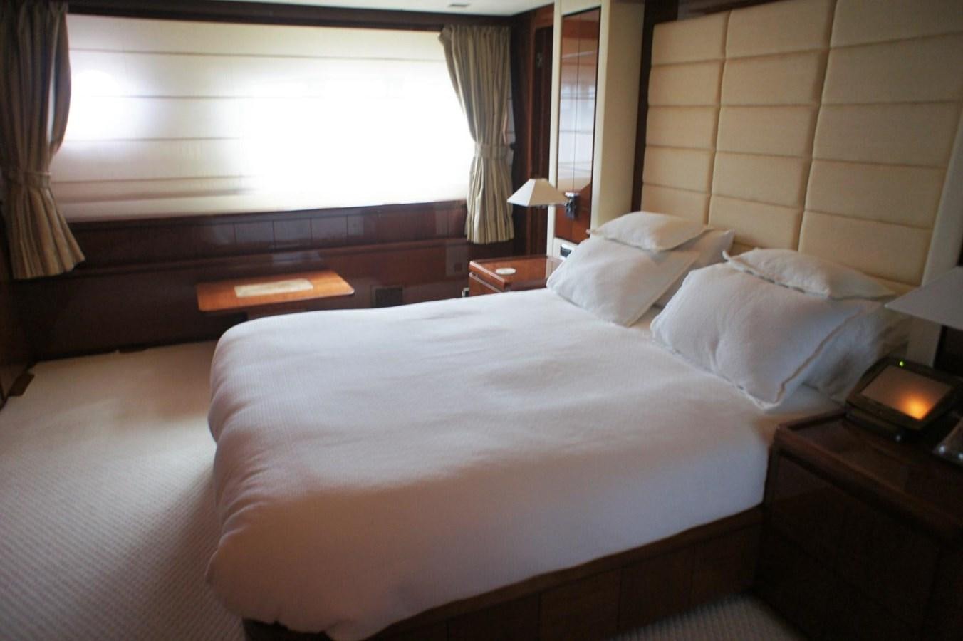a bed with white sheets aboard CASPIAN Yacht for Sale