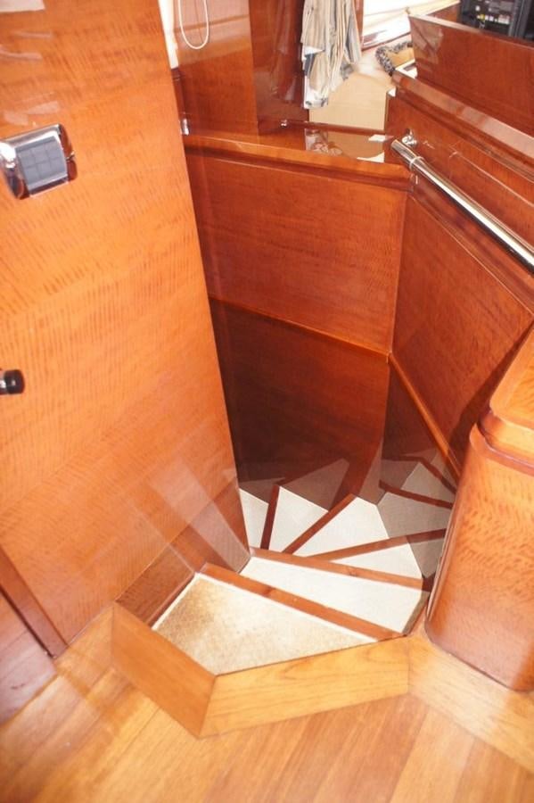 a wooden cabinet with a door aboard CASPIAN Yacht for Sale