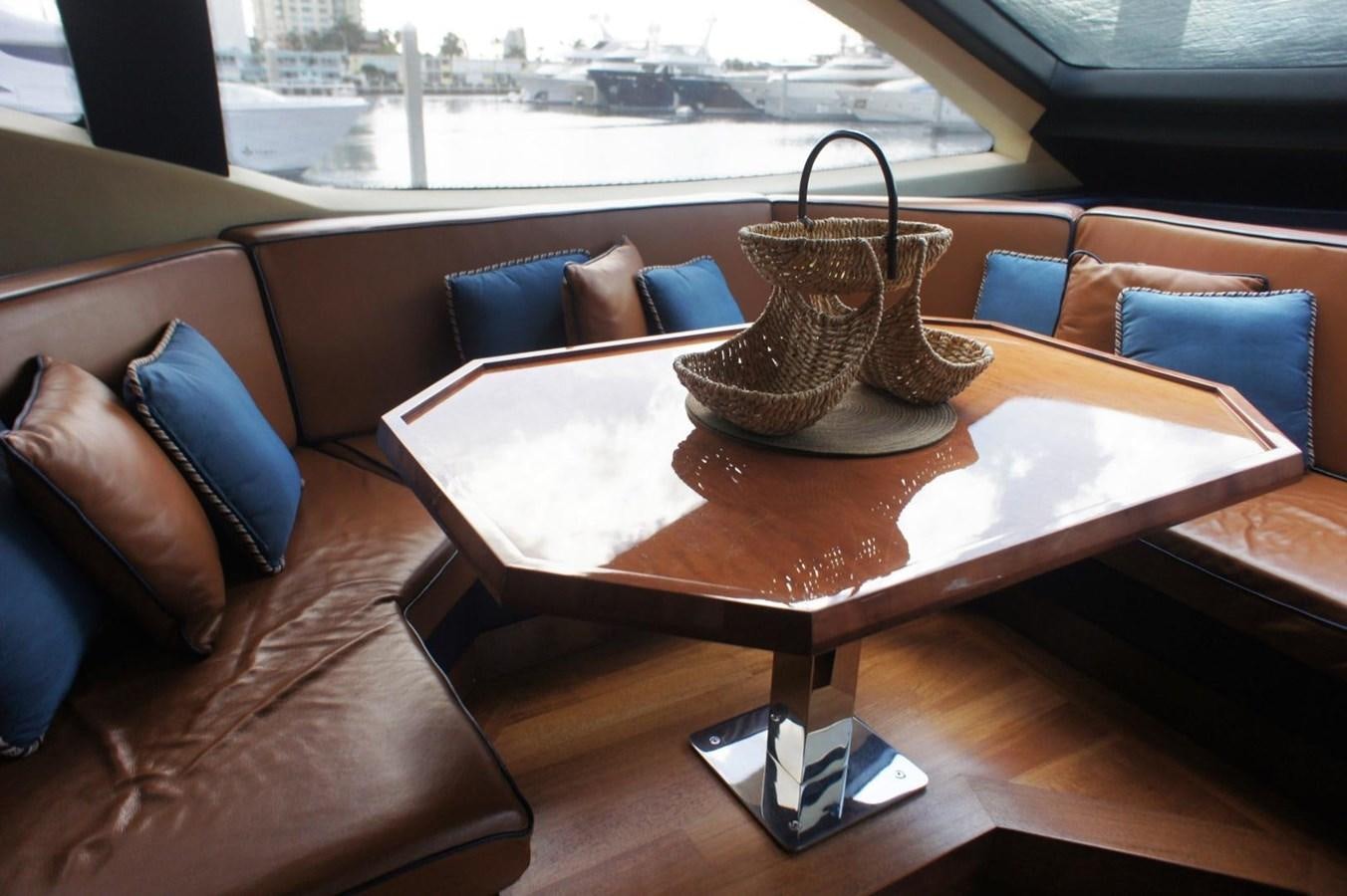 a coffee table with a lamp on it aboard CASPIAN Yacht for Sale