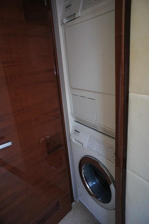 a washer and dryer in a closet aboard CASPIAN Yacht for Sale