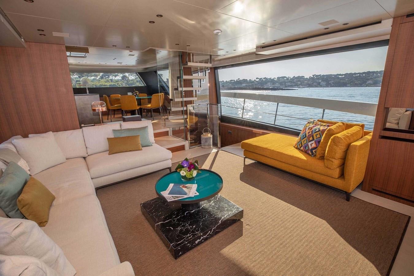 a living room with a couch and a table aboard 2019 SANLORENZO SX76 #16 Yacht for Sale