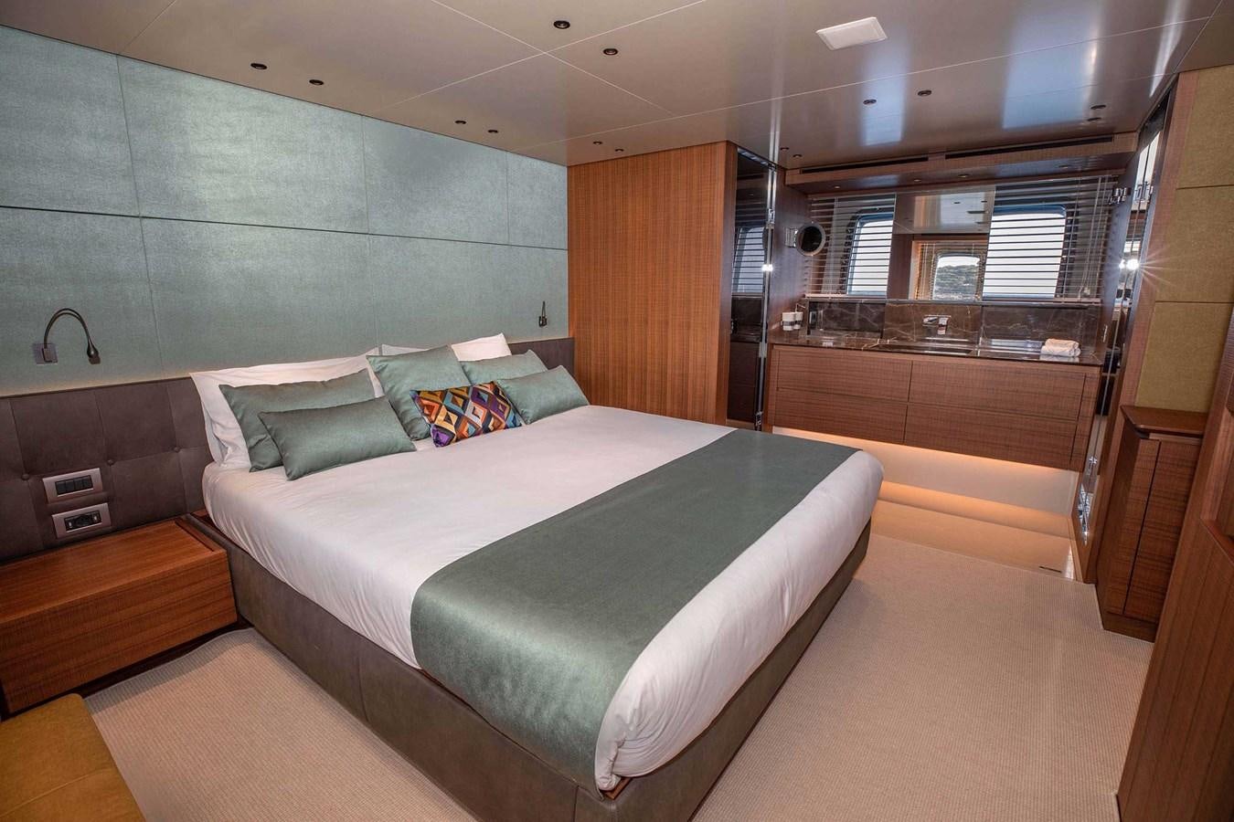 a room with a bed and a window aboard 2019 SANLORENZO SX76 #16 Yacht for Sale