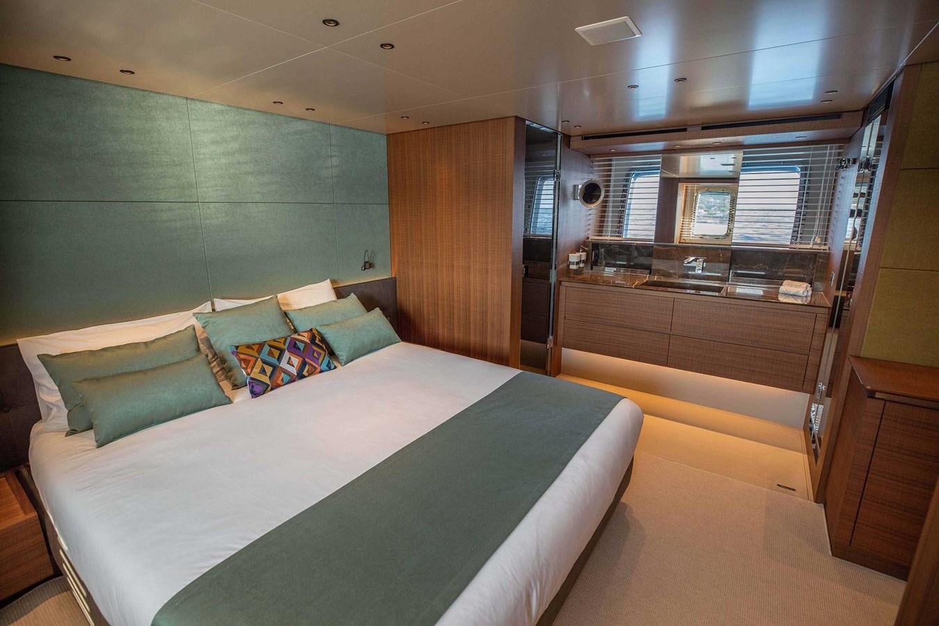 a room with a bed and a window aboard 2019 SANLORENZO SX76 #16 Yacht for Sale