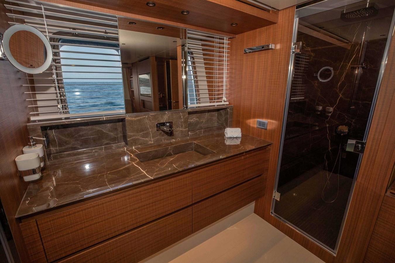 a bathroom with a large mirror aboard 2019 SANLORENZO SX76 #16 Yacht for Sale
