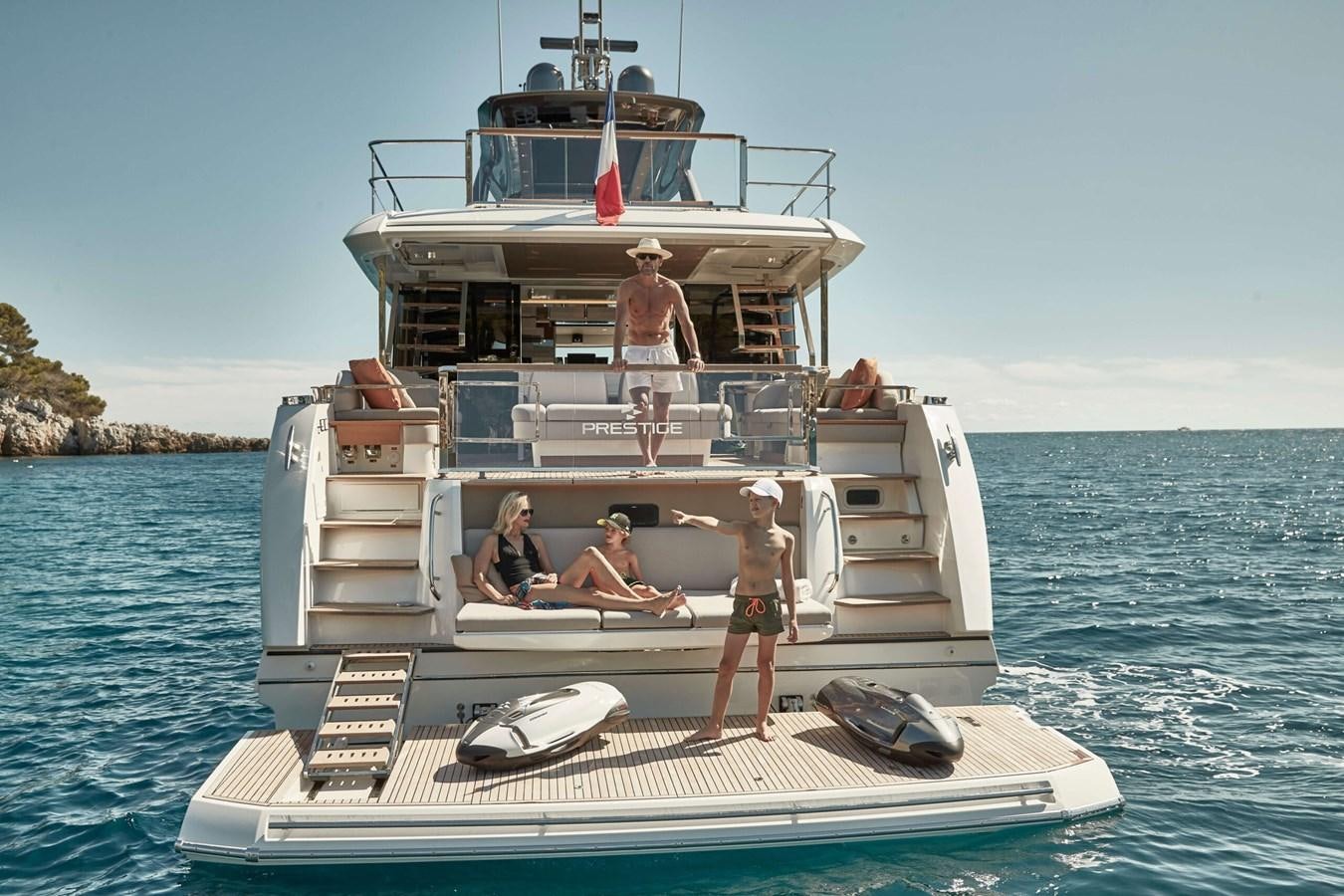 a group of people on a boat aboard 2022 PRESTIGE X70 #09 Yacht for Sale