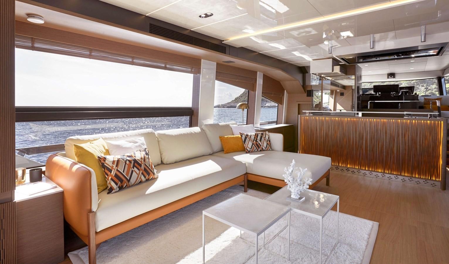 a living room with a large window aboard 2022 PRESTIGE X70 #09 Yacht for Sale
