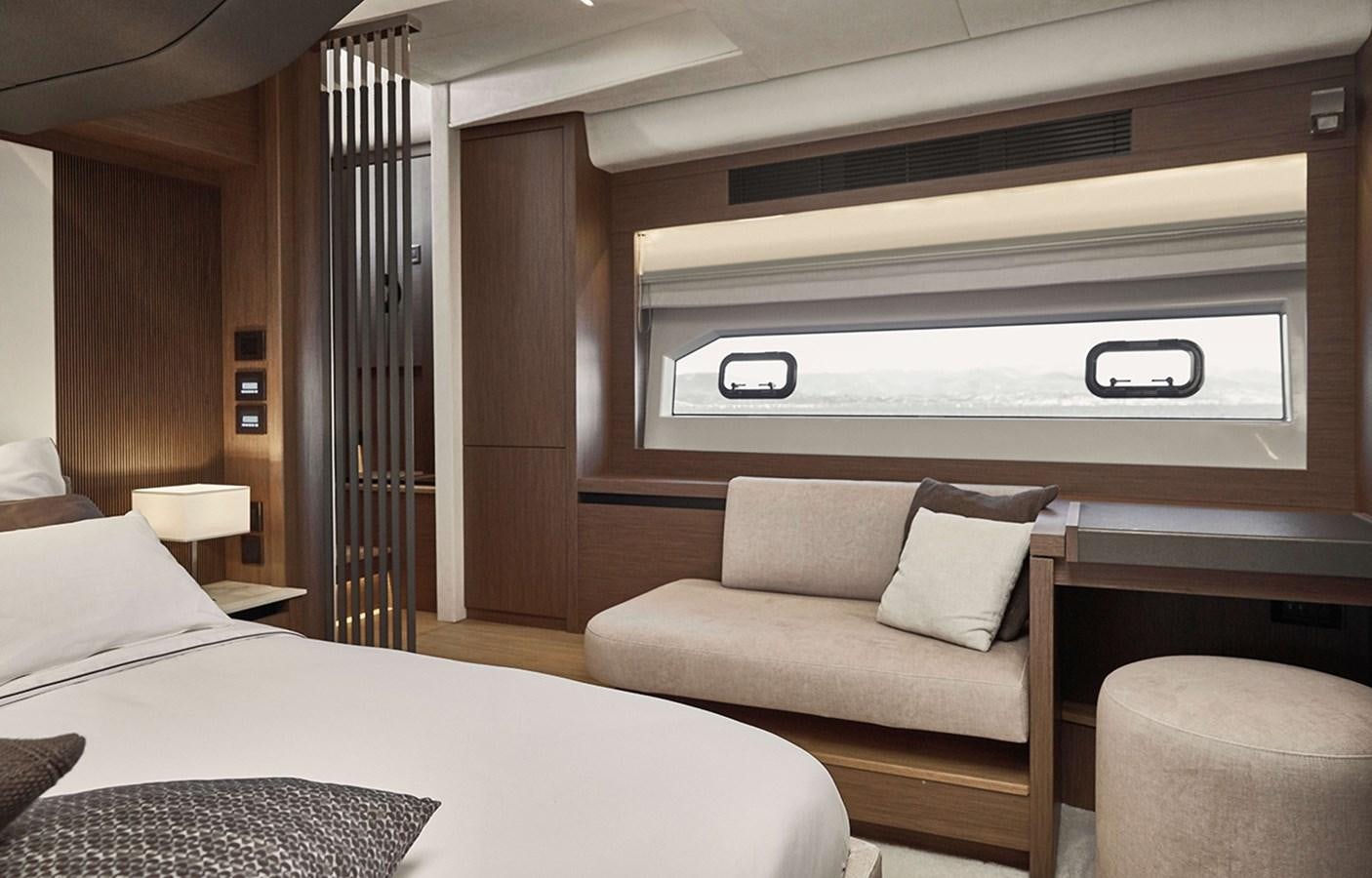 a room with a bed and a couch aboard 2022 PRESTIGE X70 #09 Yacht for Sale