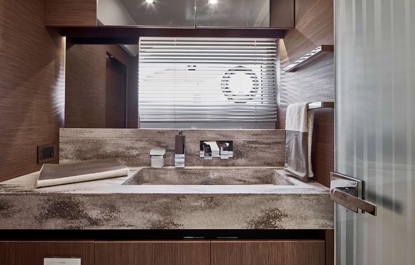 a bathroom with a large mirror aboard 2022 PRESTIGE X70 #09 Yacht for Sale