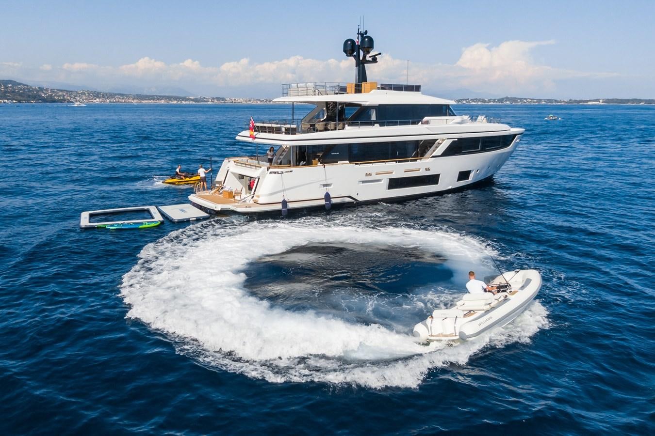 a couple of large white boats in the water aboard MRS L Yacht for Sale