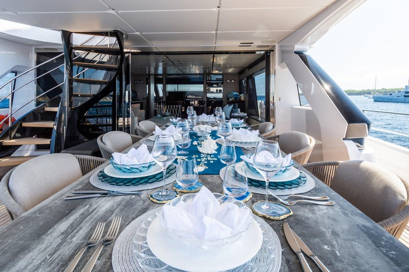 a table set for a dinner aboard MRS L Yacht for Sale