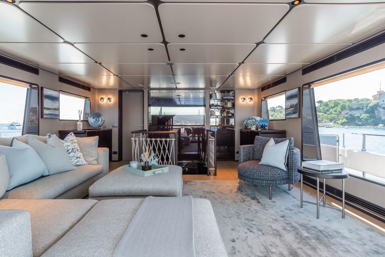 a living room with a large window aboard MRS L Yacht for Sale