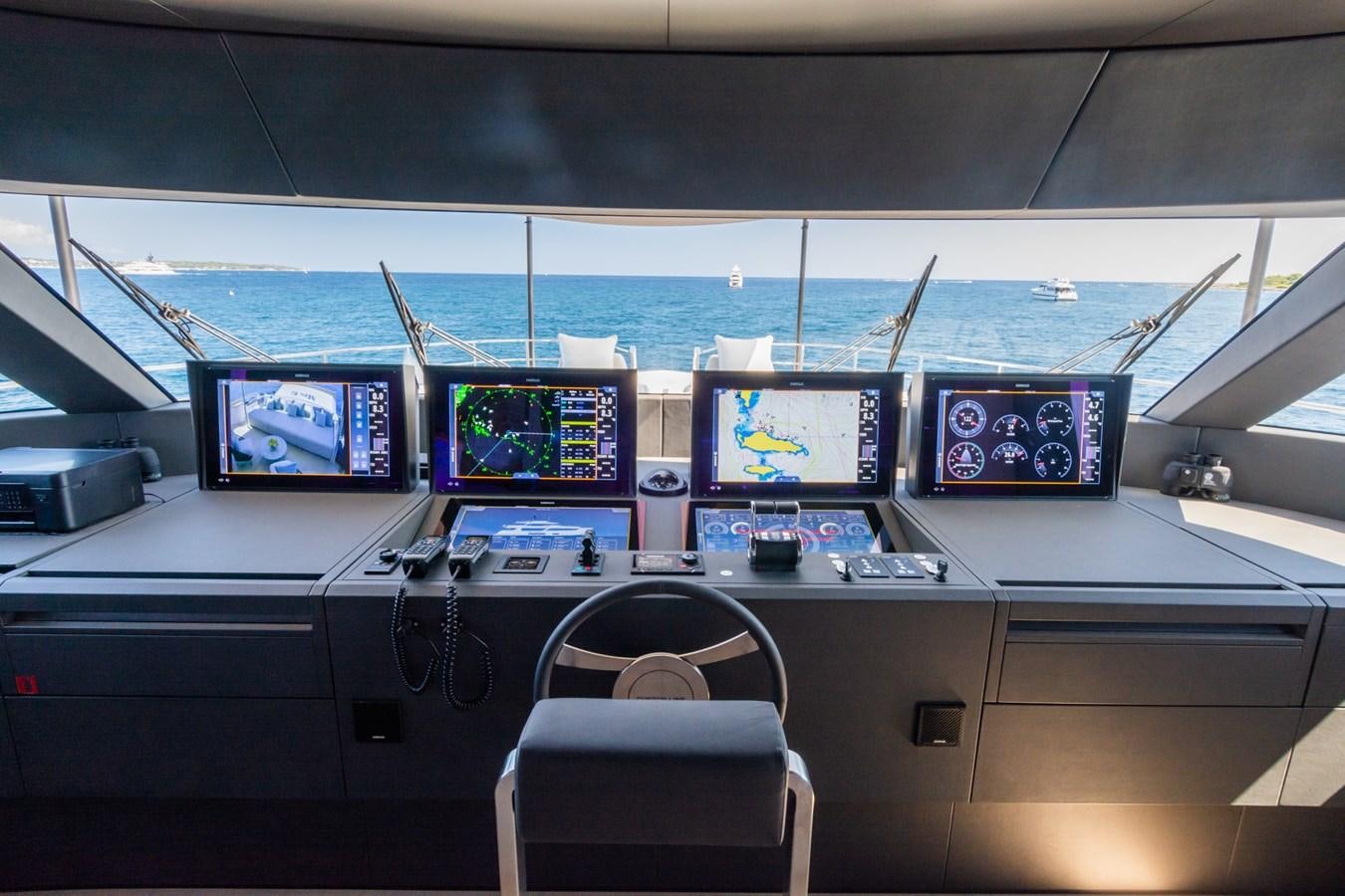 a row of computer screens on a desk aboard MRS L Yacht for Sale