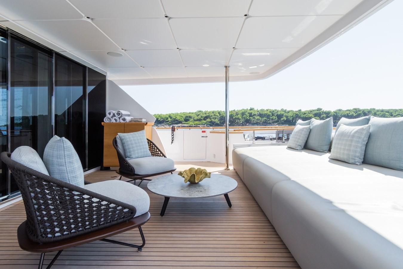 a living room with a large window aboard MRS L Yacht for Sale
