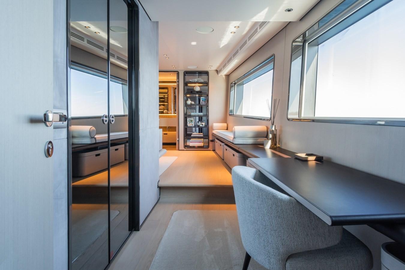 a room with a table and chairs aboard MRS L Yacht for Sale