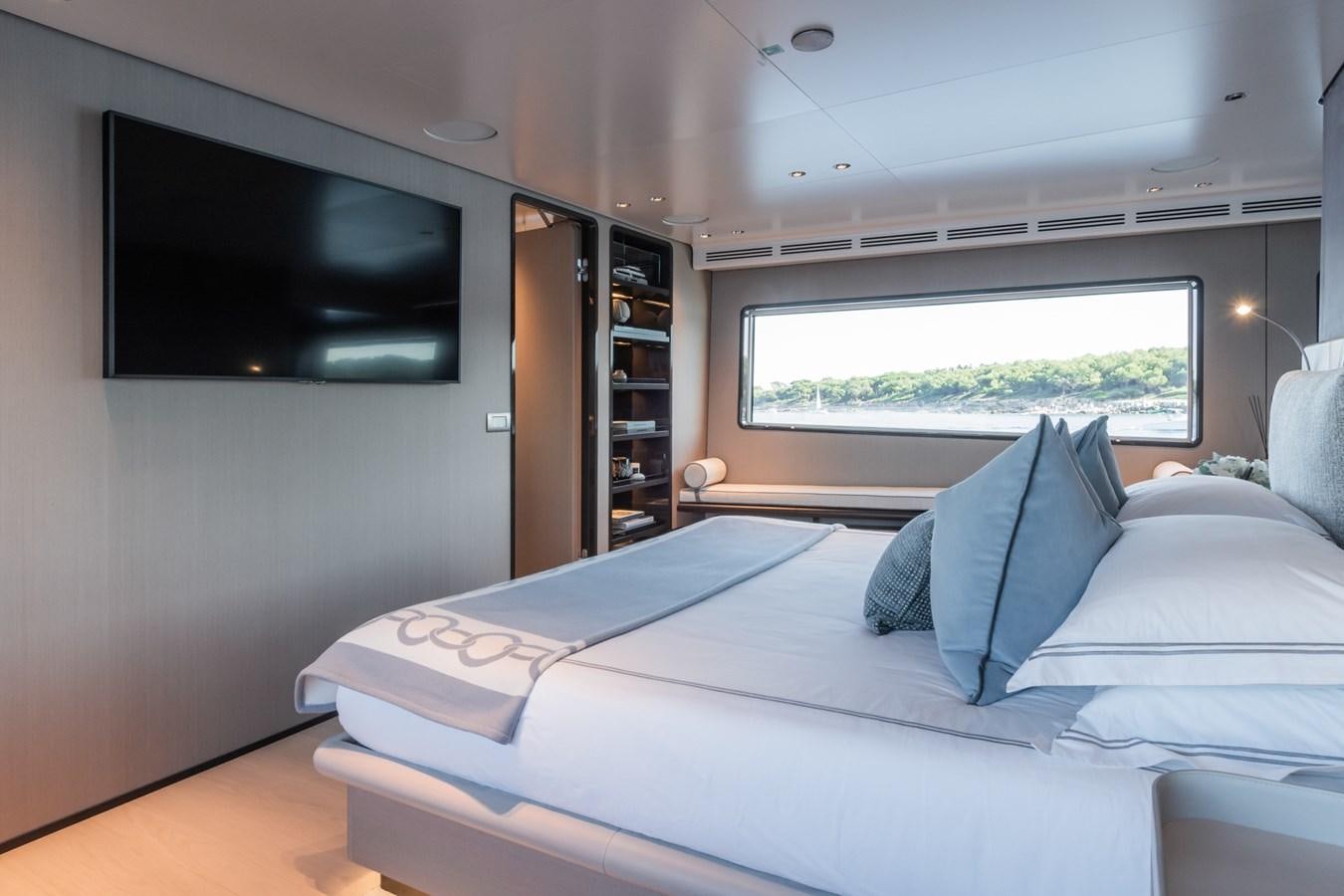 a bed in a room aboard MRS L Yacht for Sale