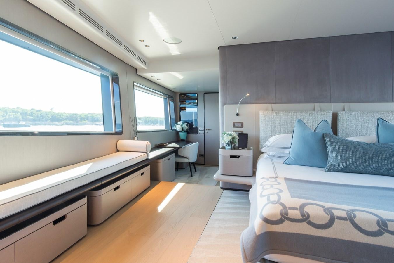 a bedroom with a large bed aboard MRS L Yacht for Sale