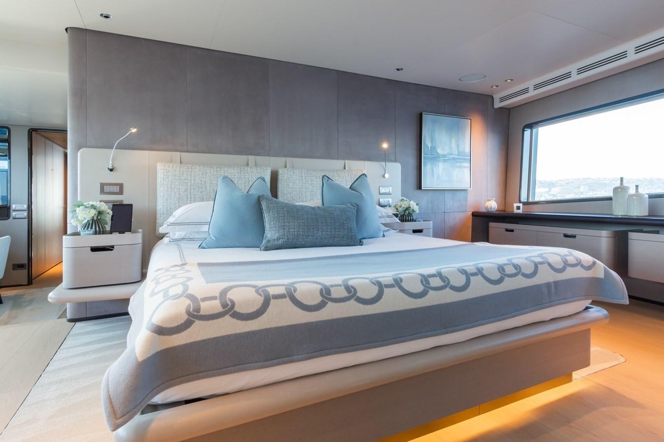 a bed with a white sheet aboard MRS L Yacht for Sale