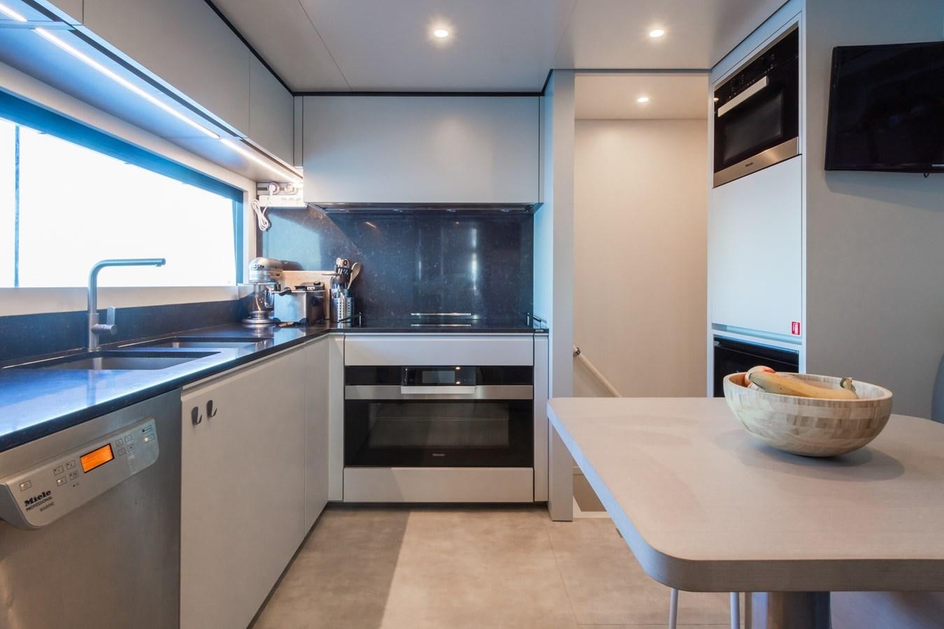 a kitchen with a bowl of cereal aboard MRS L Yacht for Sale
