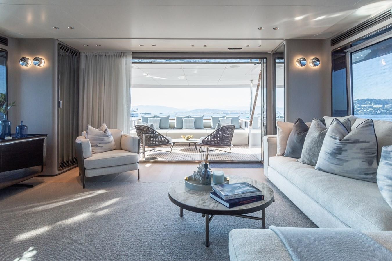 a living room with a large window aboard MRS L Yacht for Sale