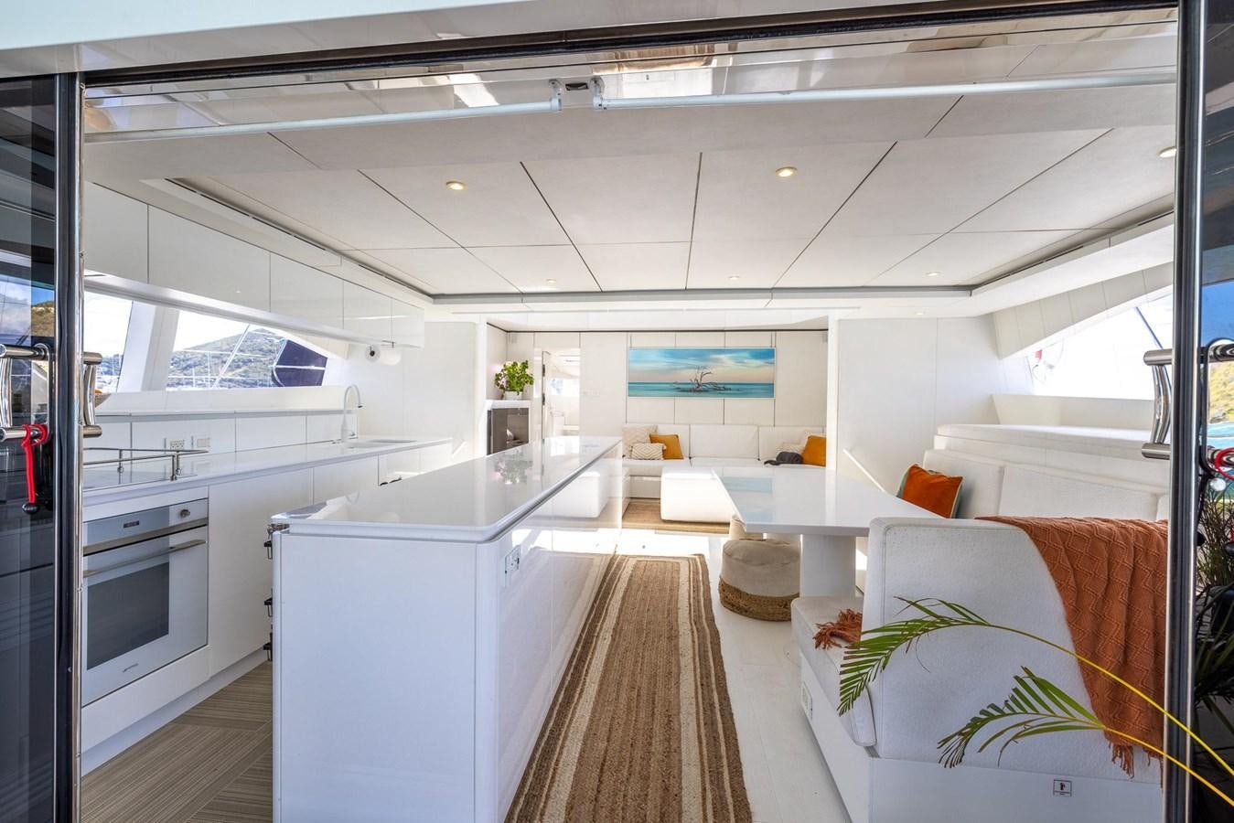 a kitchen with white cabinets aboard VALHALLA Yacht for Sale