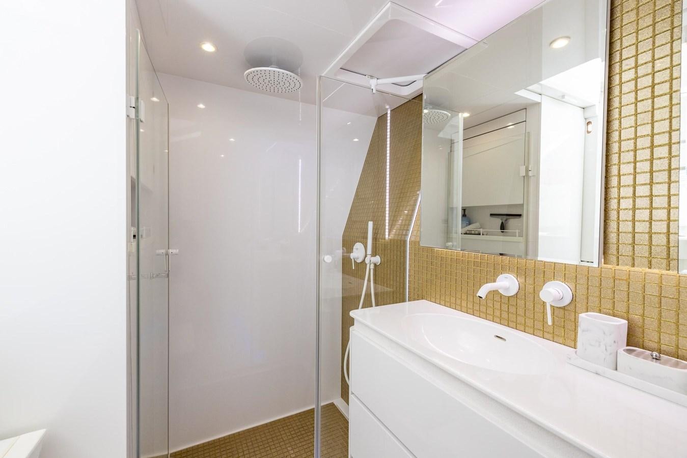 a bathroom with a bathtub and a shower aboard VALHALLA Yacht for Sale