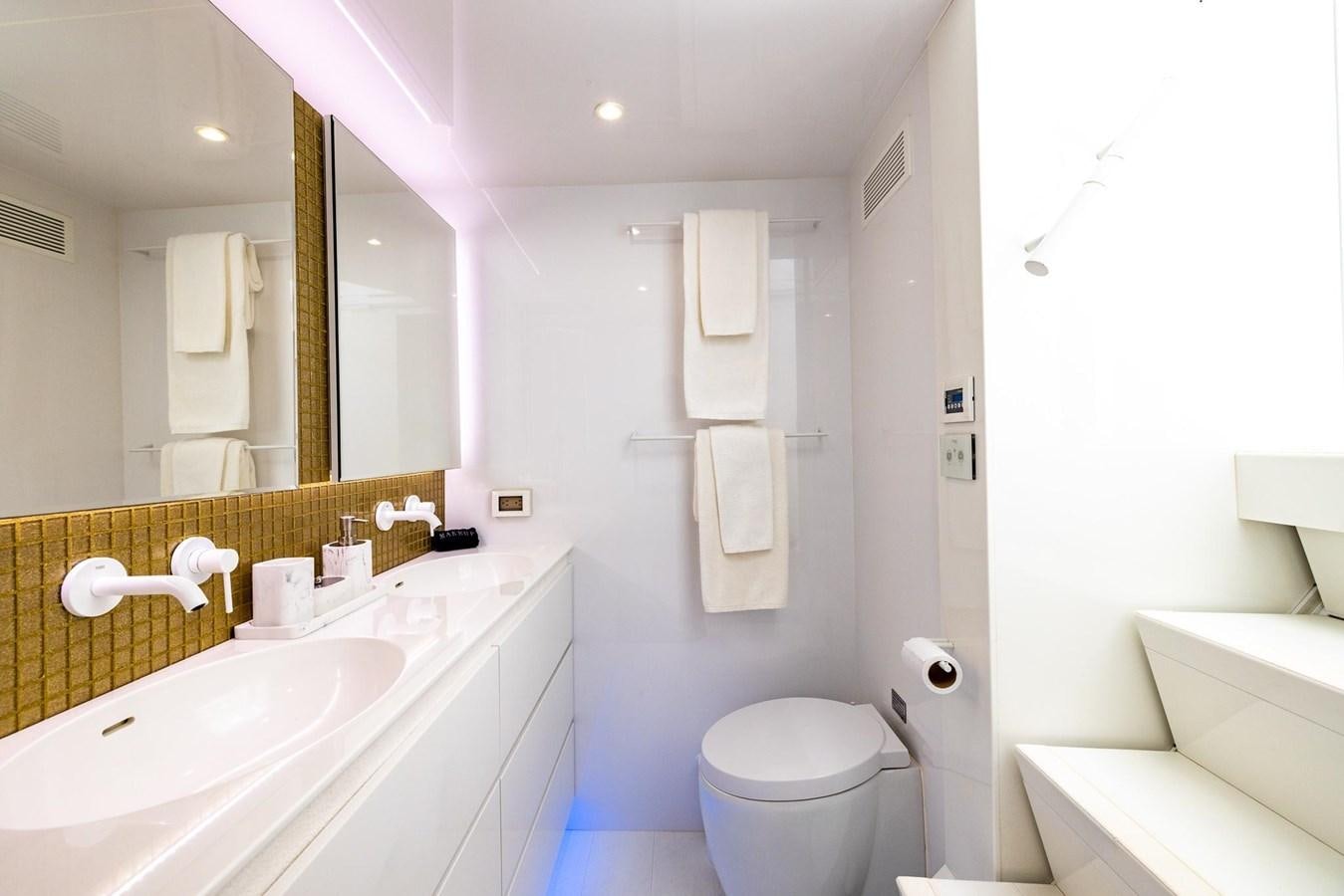a bathroom with a toilet and a sink aboard VALHALLA Yacht for Sale