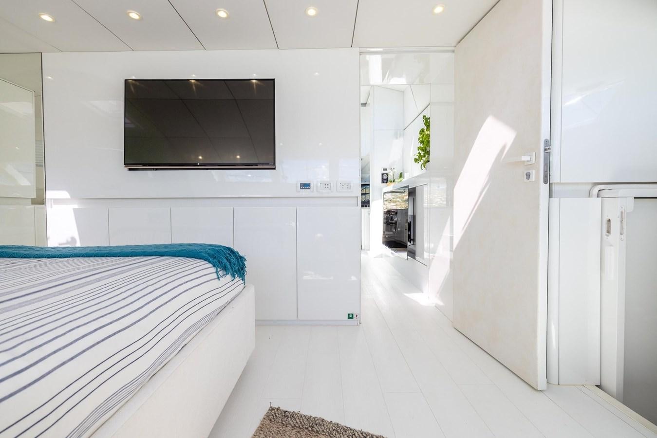 a room with a bed and a tv aboard VALHALLA Yacht for Sale