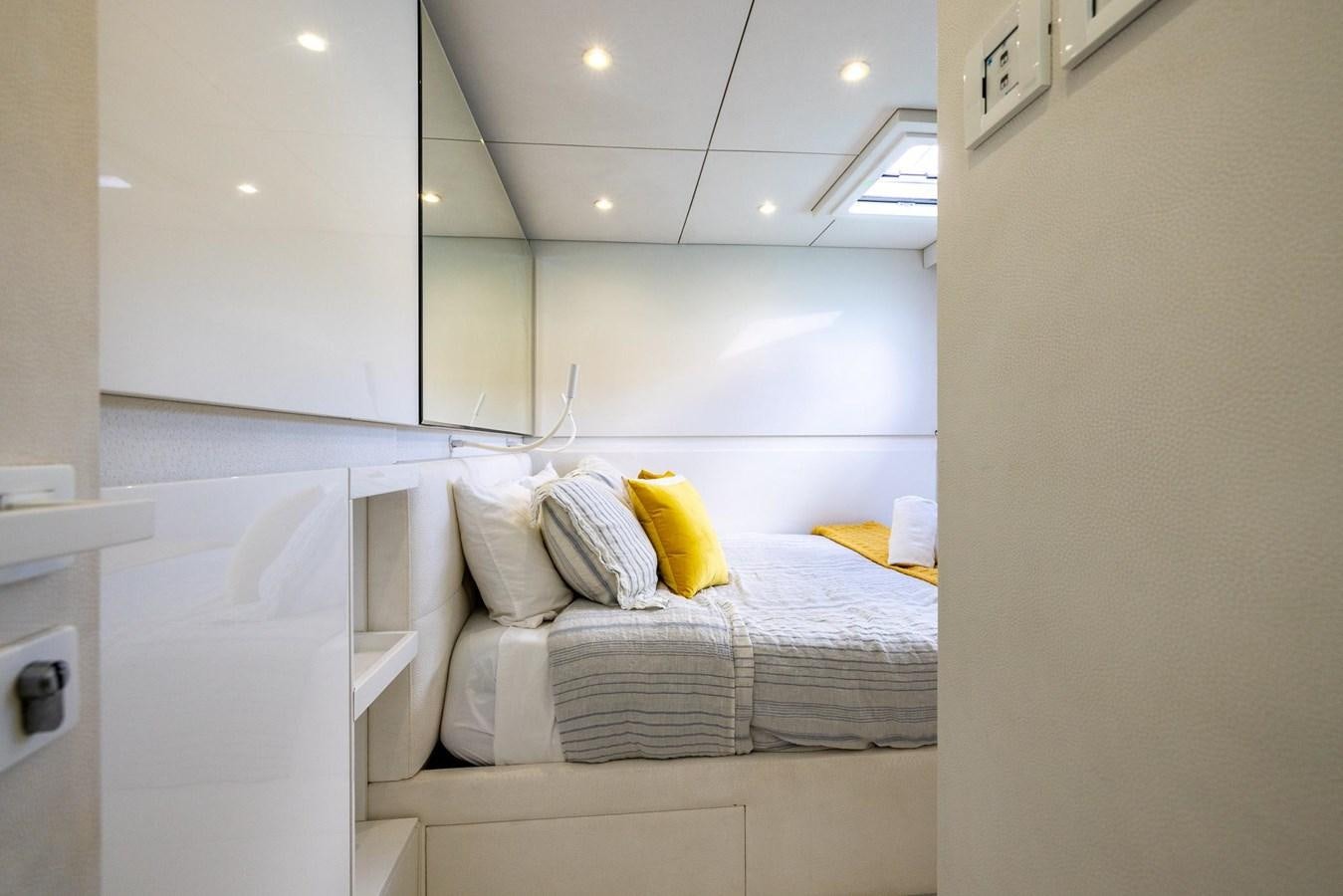 a room with a bed and a mirror aboard VALHALLA Yacht for Sale
