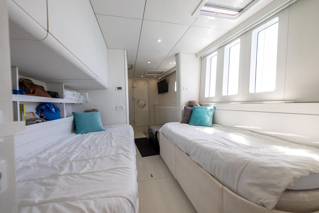 a room with white beds aboard VALHALLA Yacht for Sale