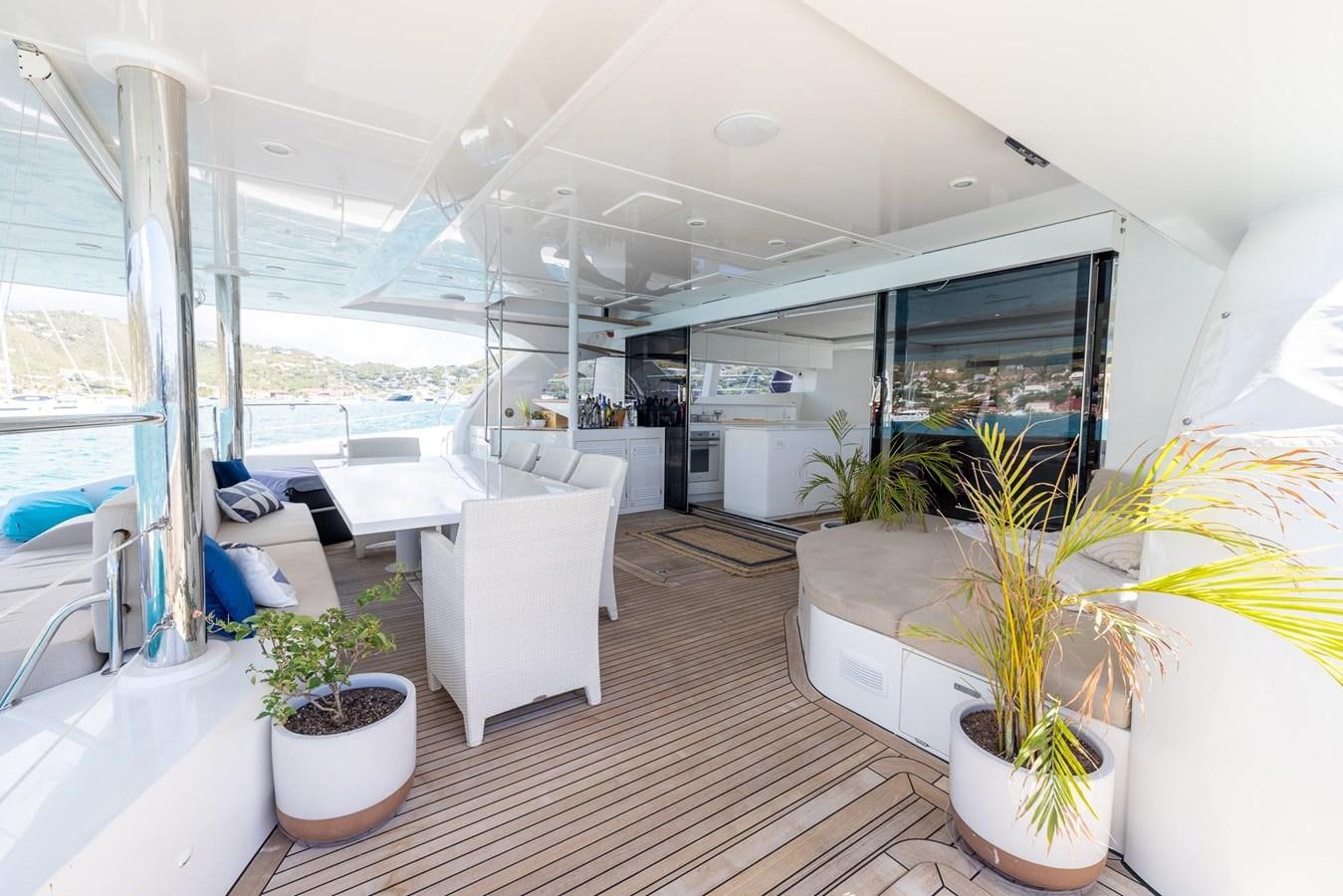 a room with a large window and plants aboard VALHALLA Yacht for Sale