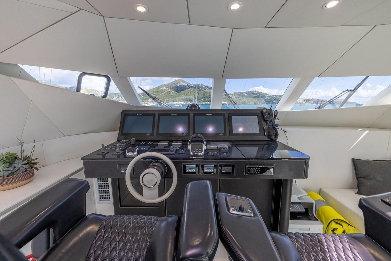 inside of a vehicle with a large speaker and a large window aboard VALHALLA Yacht for Sale