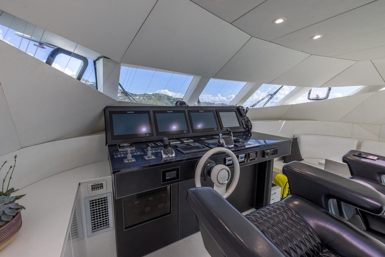 inside of a vehicle with a desk and chairs and a computer aboard VALHALLA Yacht for Sale