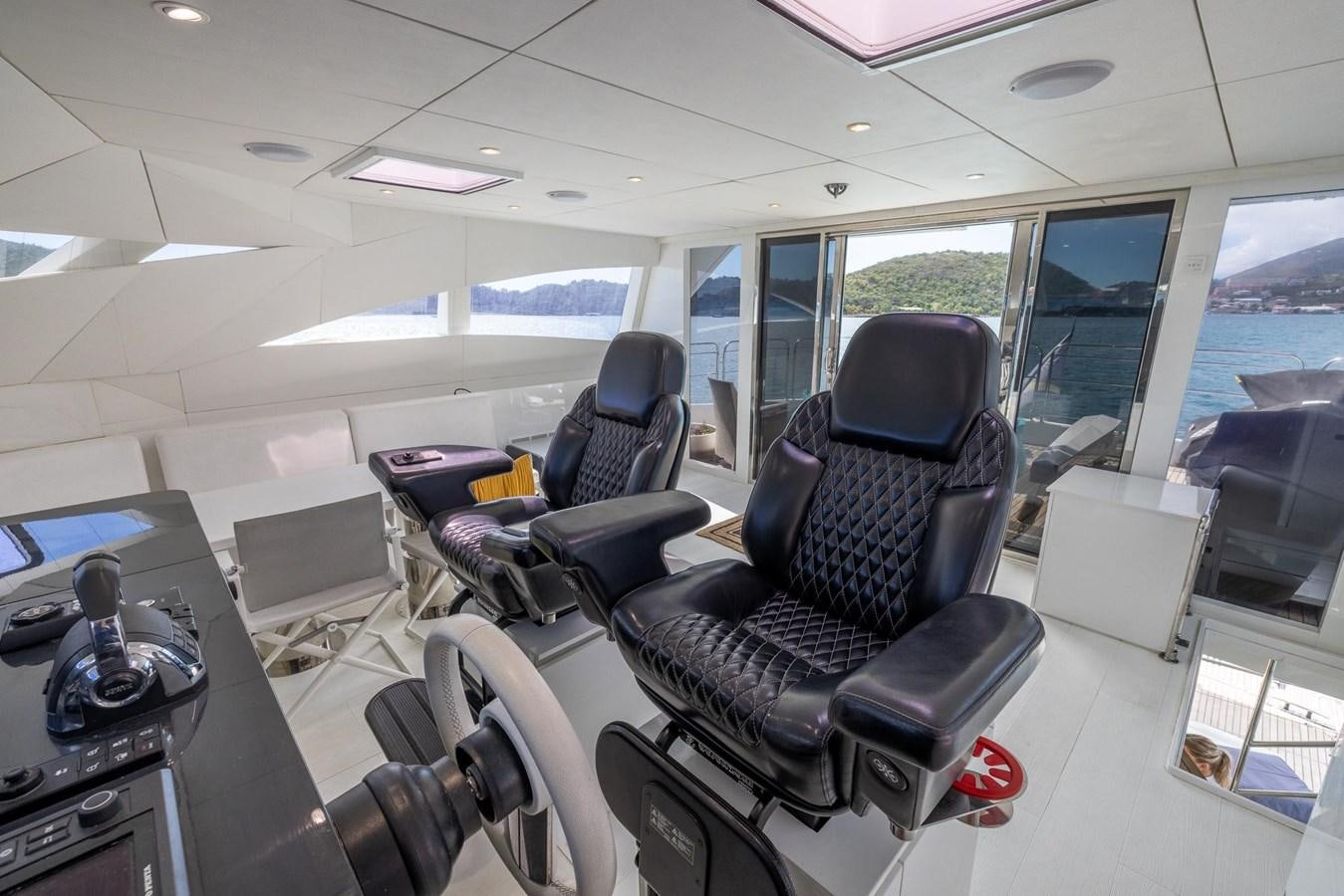 inside of a vehicle with many seats aboard VALHALLA Yacht for Sale