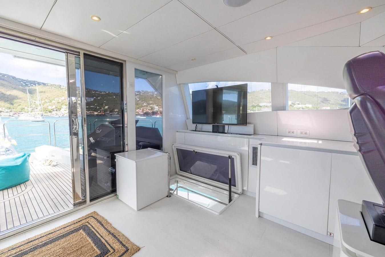 a room with a large window and a tv aboard VALHALLA Yacht for Sale