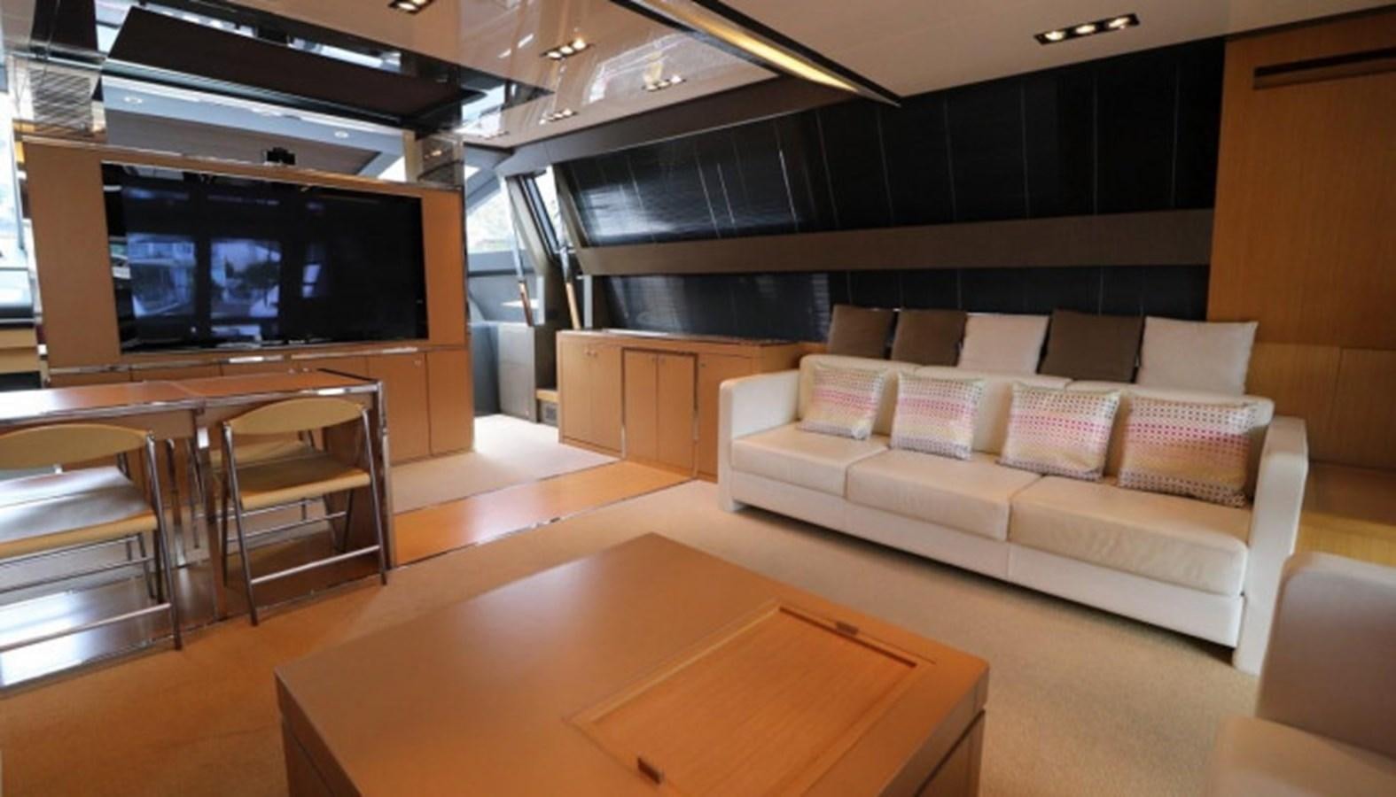 a living room with a couch and a tv aboard SILVER BREEZE Yacht for Sale