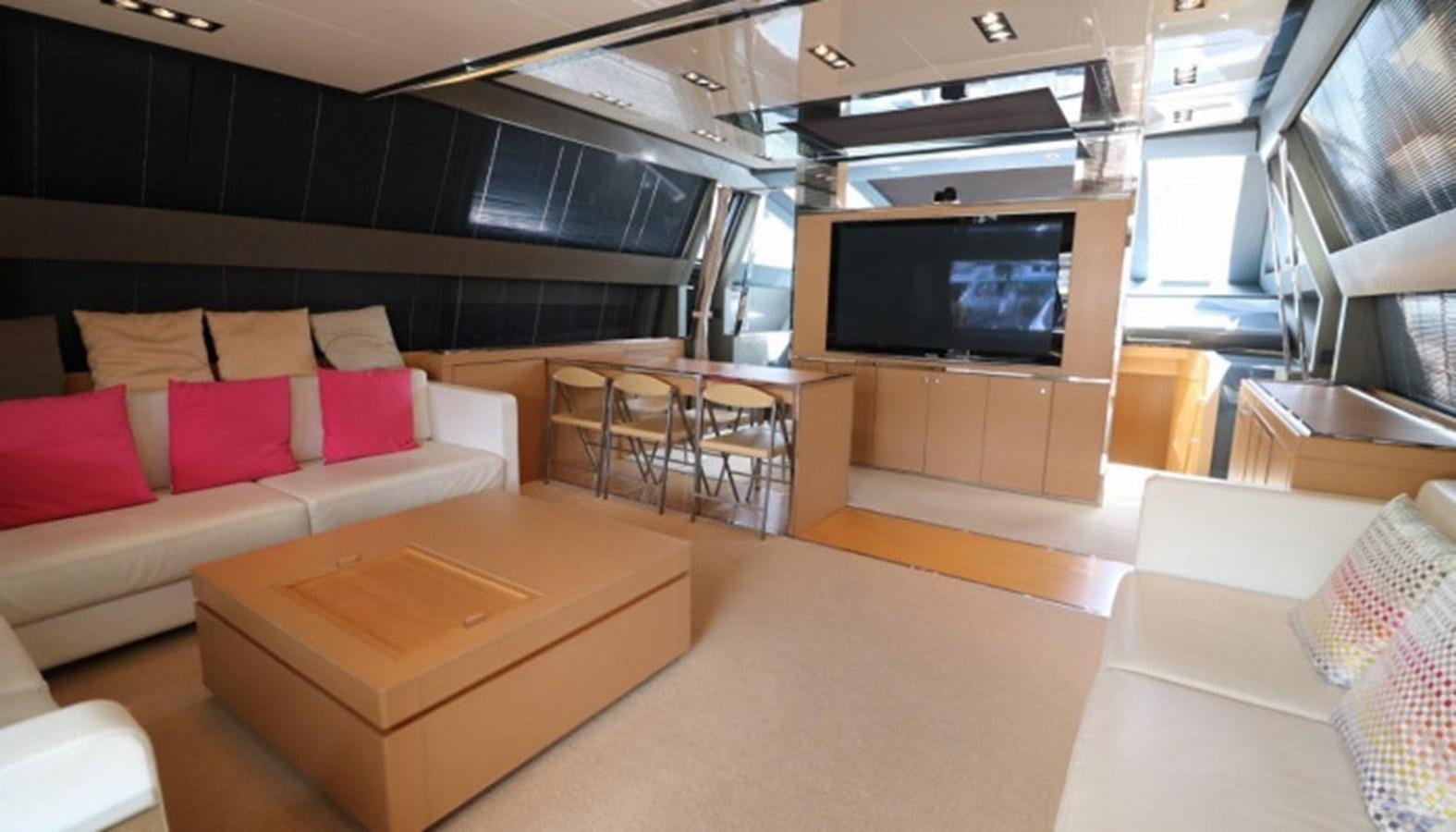 a living room with a couch and a tv aboard SILVER BREEZE Yacht for Sale