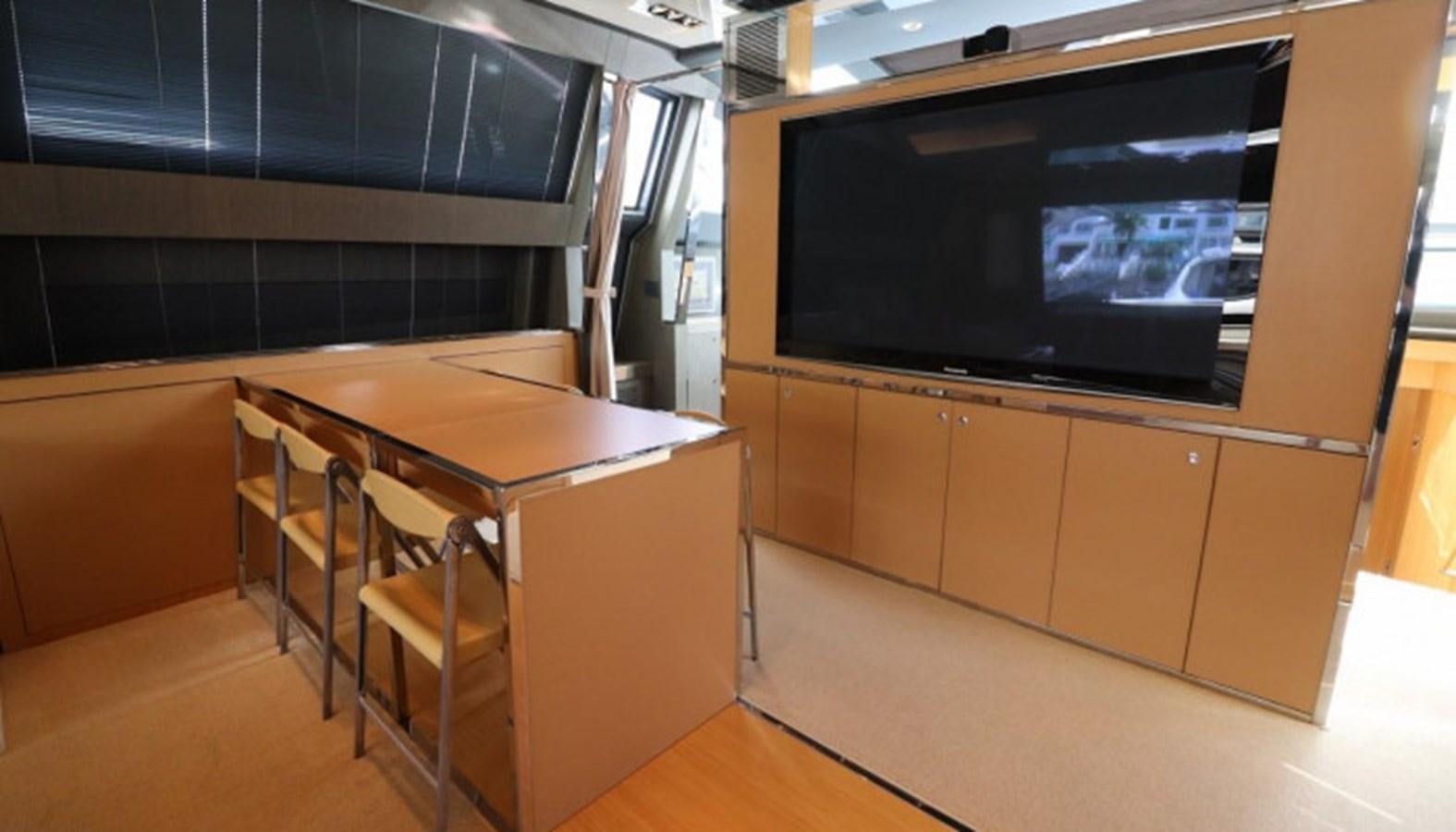 a room with a table and chairs aboard SILVER BREEZE Yacht for Sale