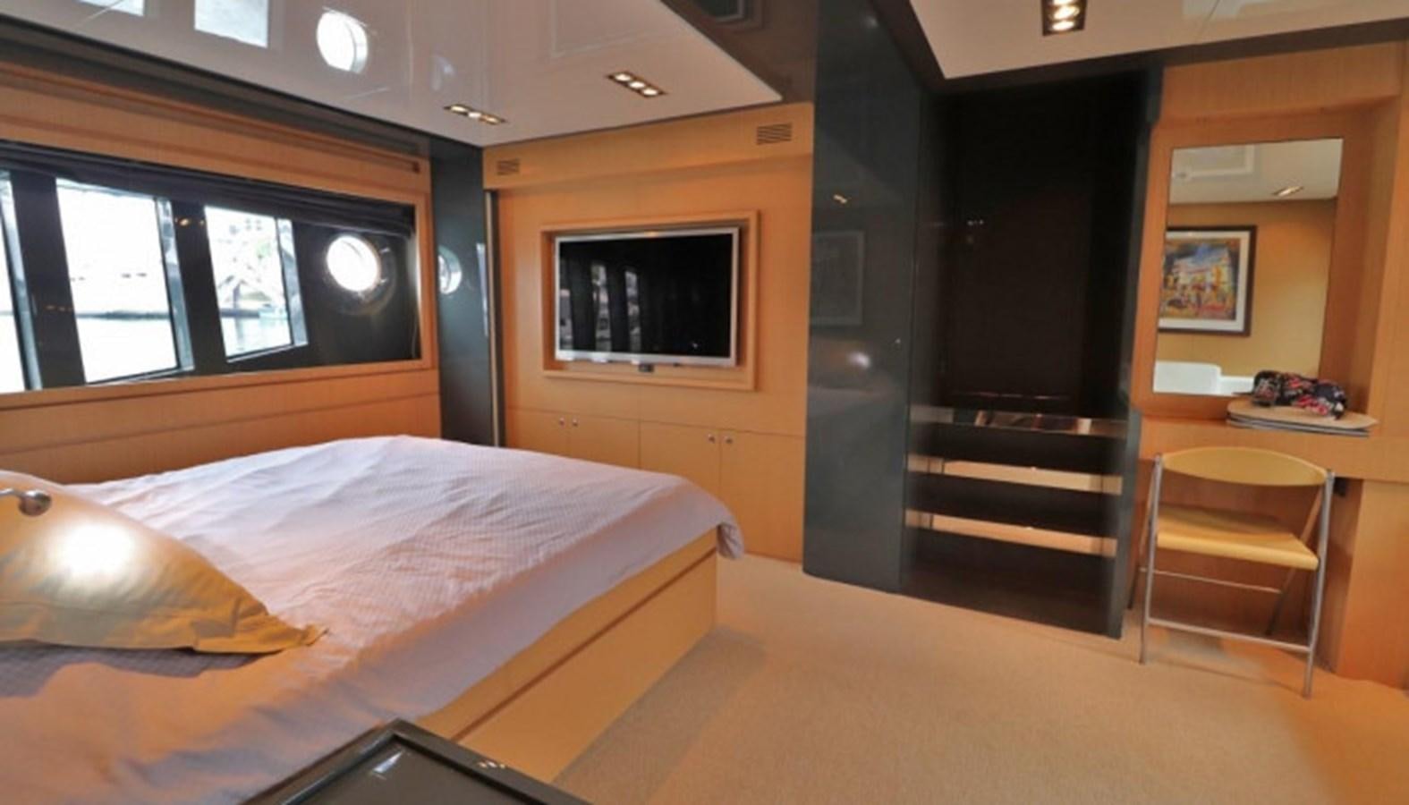 a room with a bed and a tv aboard SILVER BREEZE Yacht for Sale