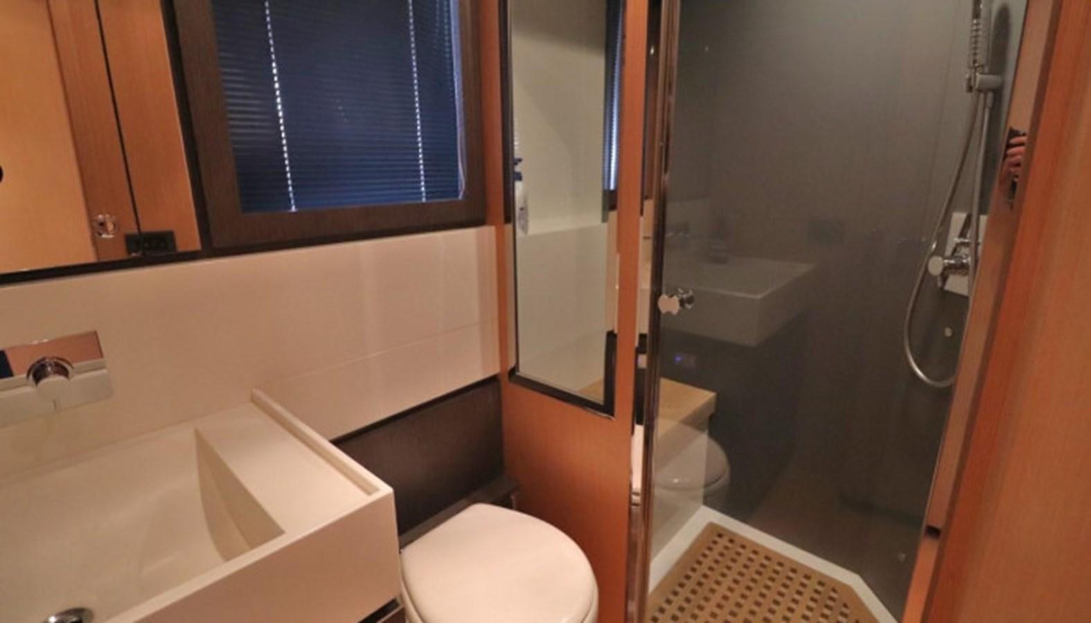 a bathroom with a sink toilet and bathtub aboard SILVER BREEZE Yacht for Sale