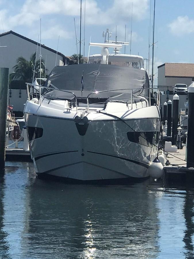 a white boat docked aboard LYDIA SWAG Yacht for Sale