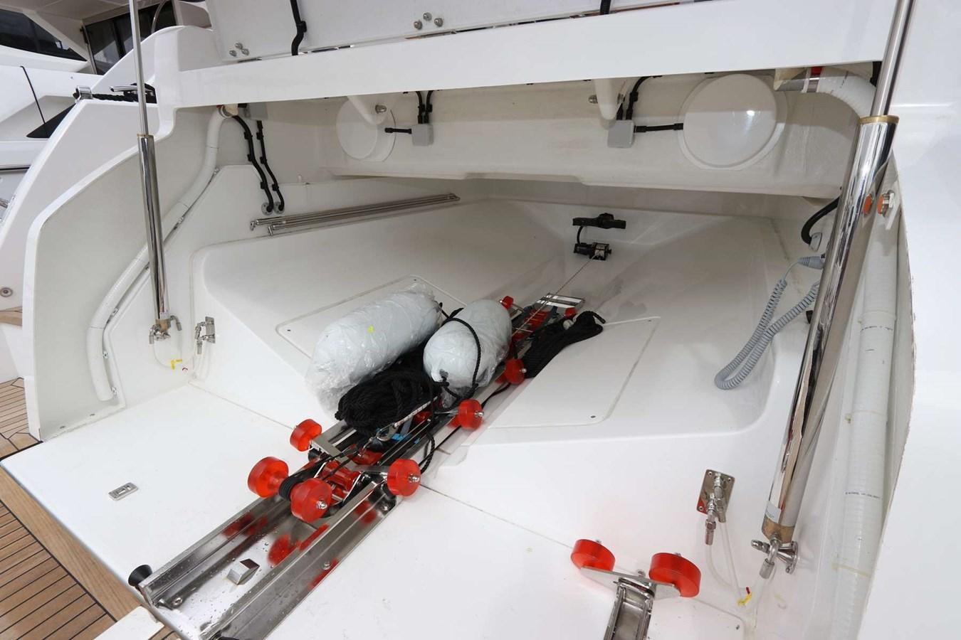 a white machine with a red and black object on it aboard LYDIA SWAG Yacht for Sale