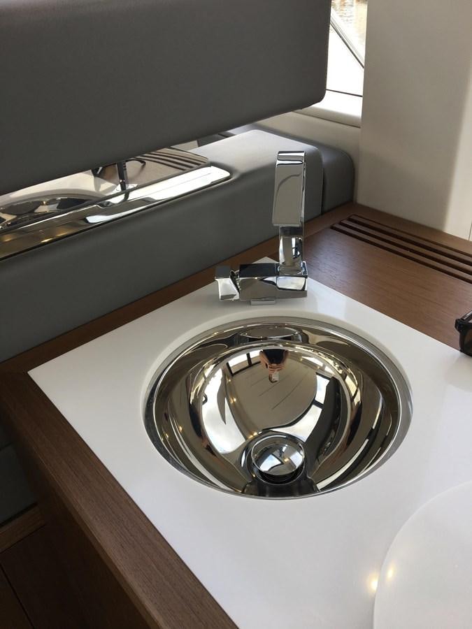 a round silver object on a white surface aboard LYDIA SWAG Yacht for Sale