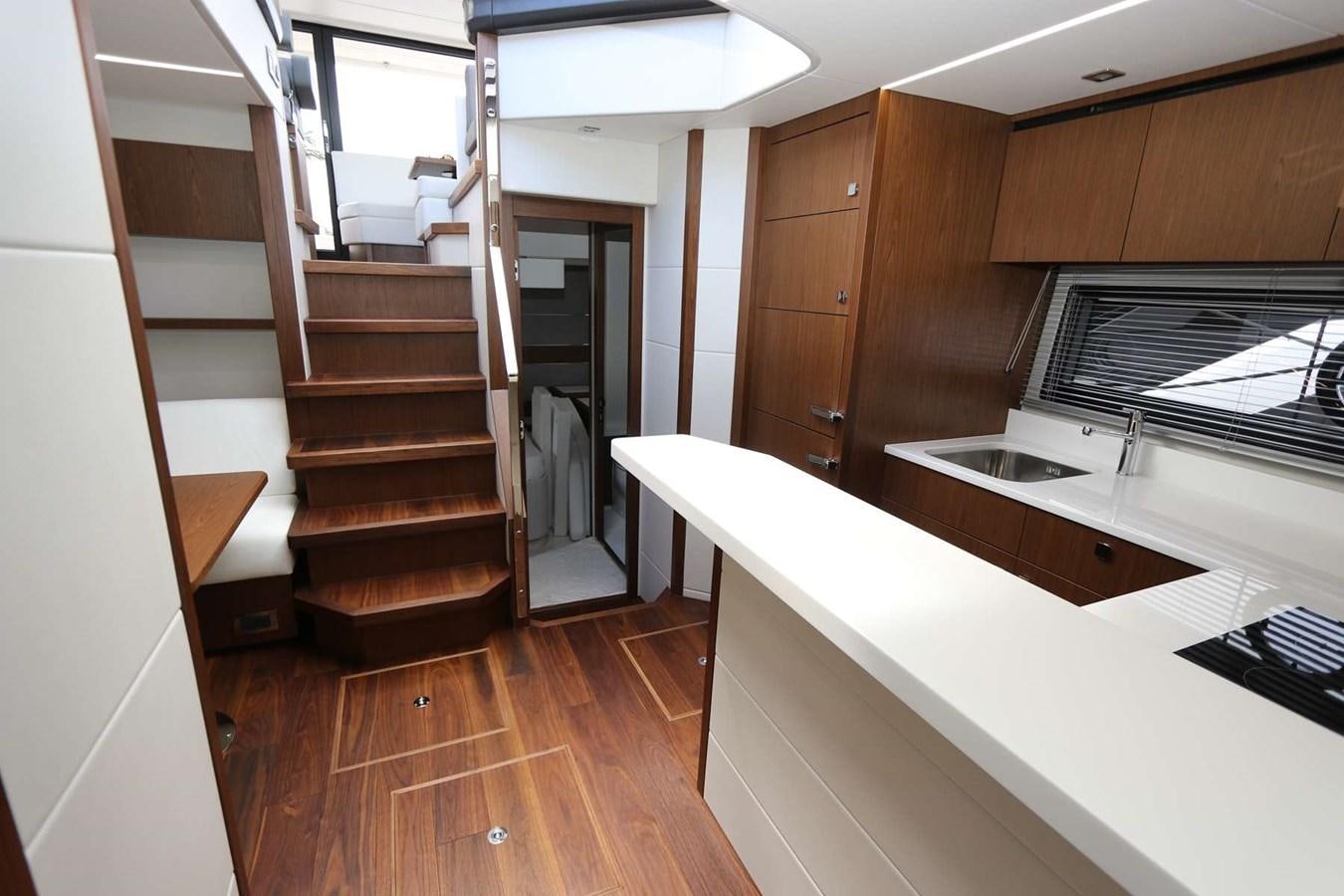 a kitchen with wooden cabinets aboard LYDIA SWAG Yacht for Sale